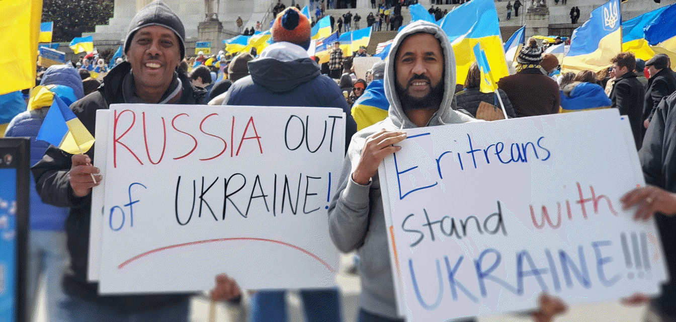 May be an image of 4 people, people standing and text that says 'RUSSIA OUT of UKRAINE! ritreans Stand with UKRAINE!!!'